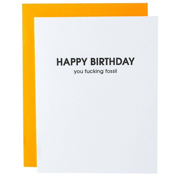 White birthday card with black text and a bright yellow envelope.