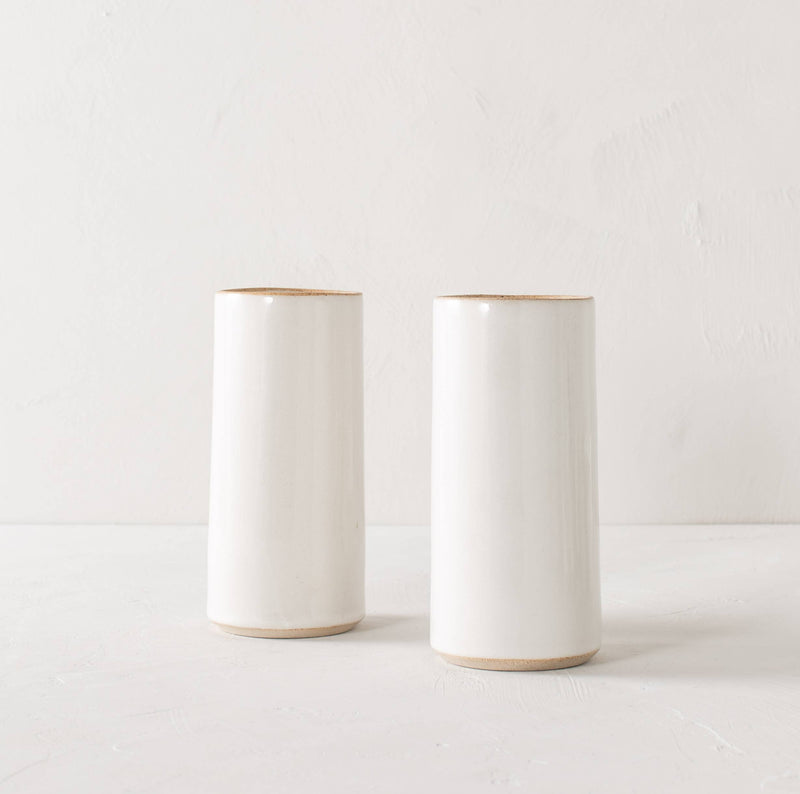 Handmade white glazed sand clay vase for flowers or cooking utensils. Cylindrical shape and coloring may vary between products due to being made by hand.