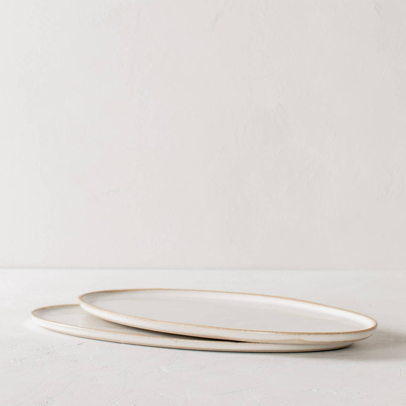 Serving platters that give food the center stage. Sand clay stoneware in an ivory glaze.