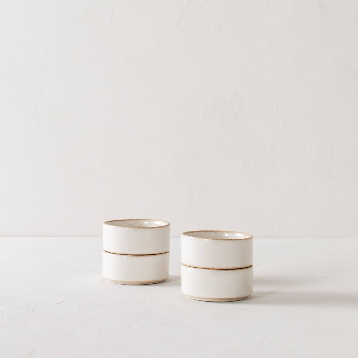 Handmade sand stoneware with an ivory glaze. Perfect for the minimalist who loves functionality.
